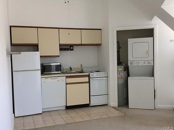 The kitchen is fully applianced - including a washer dryer.