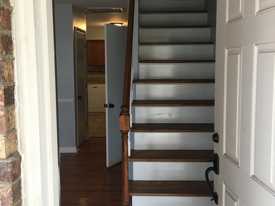 View from front door: Hardwood floors and hardwood stairs.