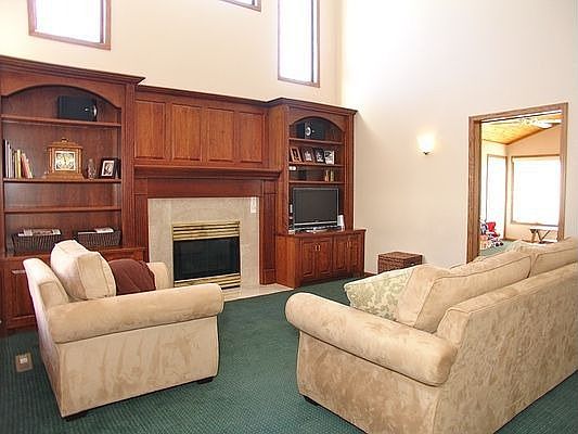 2-story family room with cherry cabinets & bookcases