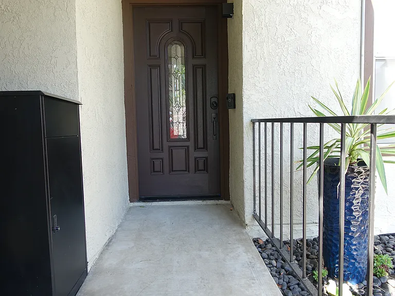 Front Entry: Beautiful mahogany door with keyless lock. Ring camera doorbell. Motion sensor porch light
