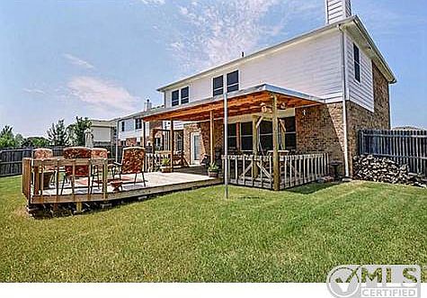 Backyard with Covered Deck and Firepit