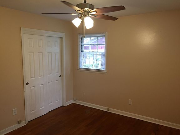Master bedroom closet and one of the two windows.