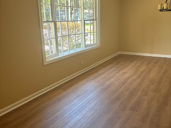 Living and Dinning Room with new LVP flooring, freshly painted, ceiling fan