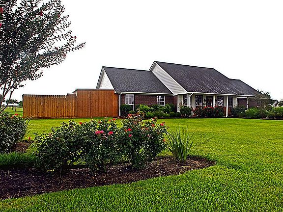 The living room offers plenty of room for entertaining guests yet is a comfortable setting for a quiet evening with just family.