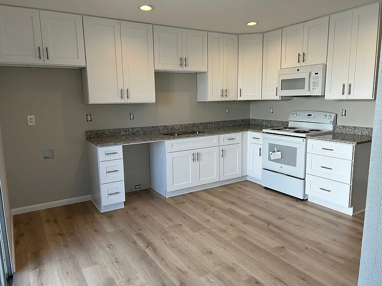 Kitchen with new cabinets and appliances (dishwasher to be installed before move in)