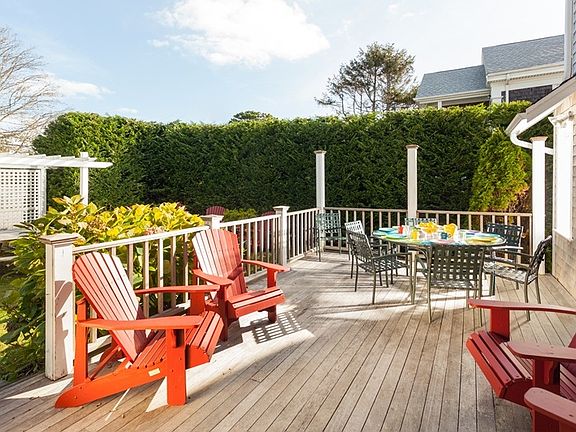Deck off back of Priscilla house- 3 picnic tables and outdoo