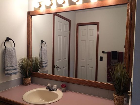 master bath with new flooring, shower, and toilet