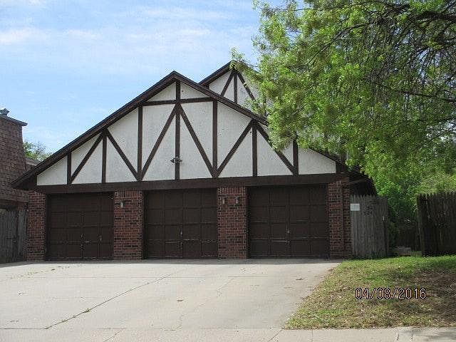 ONE CAR GARAGE; ENTRANCE TO TOWNHOMES FROM SIDE WALKWAY