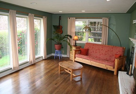 Living room. LOTS of light, oak floors, fireplace.