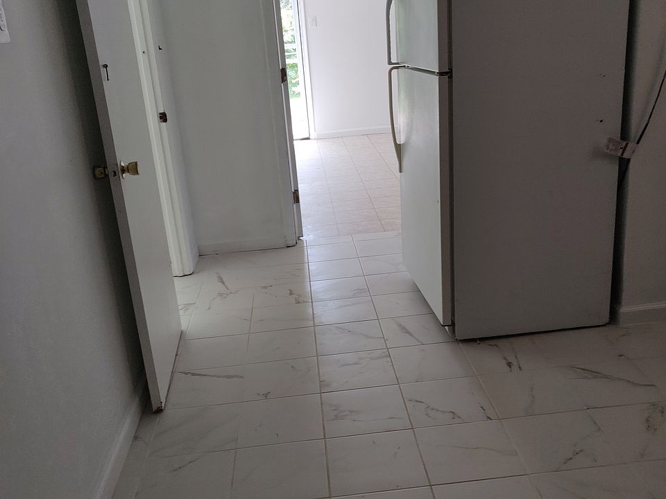This is the hallway showing the entrance to the bedroom and the bathroom to the right.