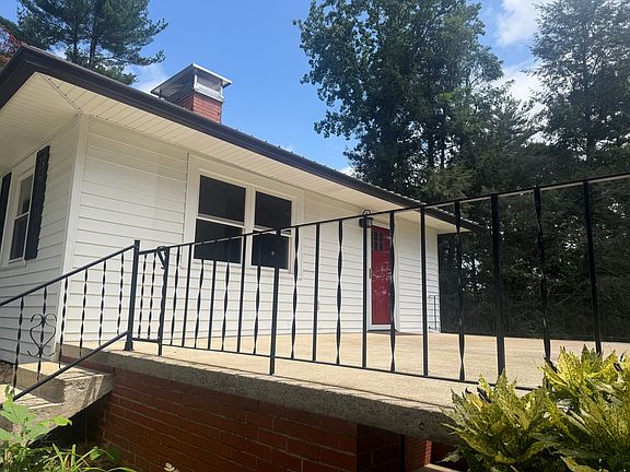 Entry to Unit 1 is off of the concrete patio and through the red door.