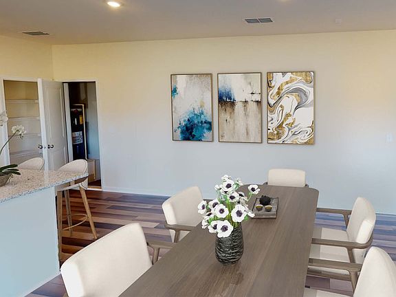 Dining area off the Kitchen opens to the main gathering areas - Model Representation