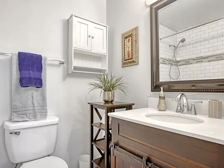 Guest bathroom with tub and shower