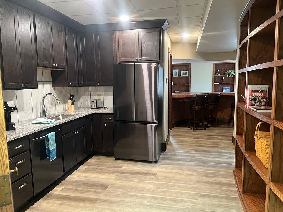 Kitchen view with bar stools