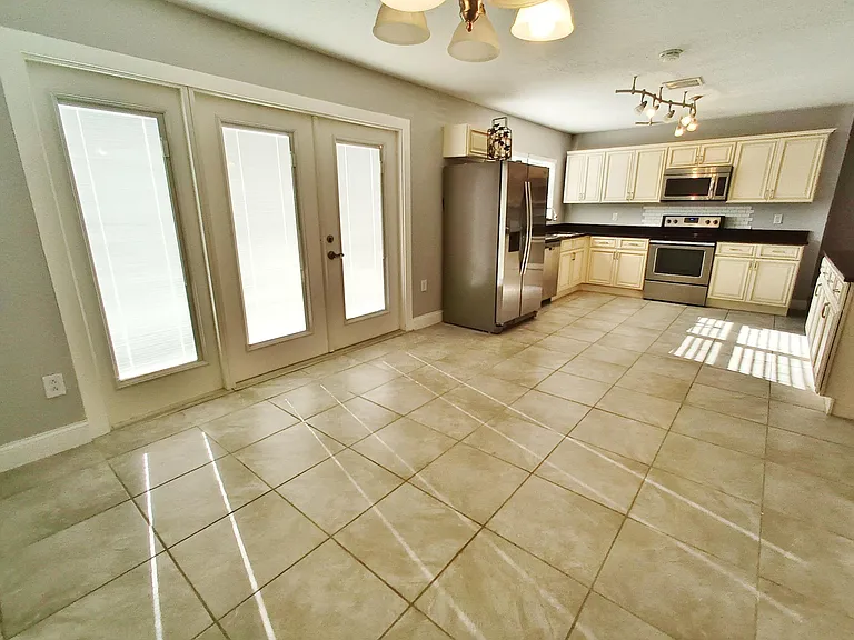 Kitchen and dining area (wide angle view with French doors closed)