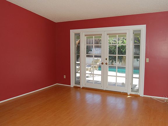 Family Room - Showing French Doors Out to Pool - Fireplace on Opposite Wall!