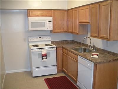 Brand new kitchen, cabinets, appliances, counter, ceramic tile