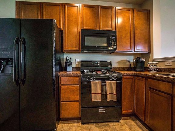 BEAUTIFUL 42" UPPER UPGRADED MAPLE CABINETS, UPGRADED COUNTER TOPS, CAN LIGHTS, BANK OF DRAWERS & LOTS OF STORAGE W/STORAGE CLOSET & PANTRY!