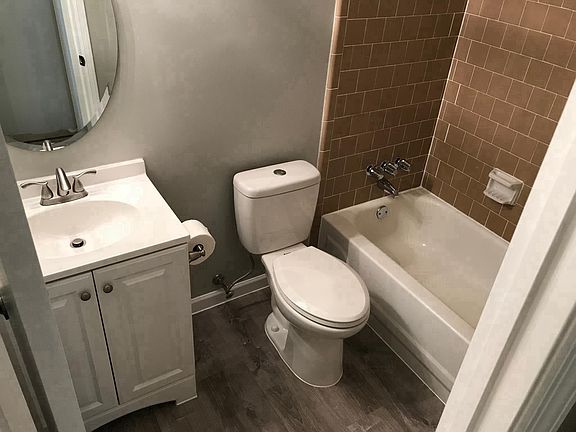 Guest Bathroom - New Flooring, Toilet, Vanity, Trim, Fixture