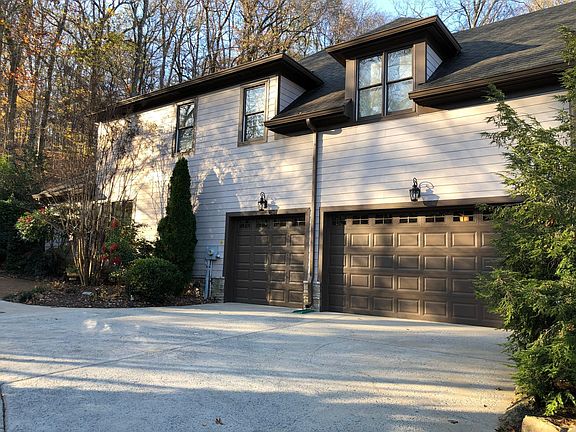 3 car garage with additional outside parking.
