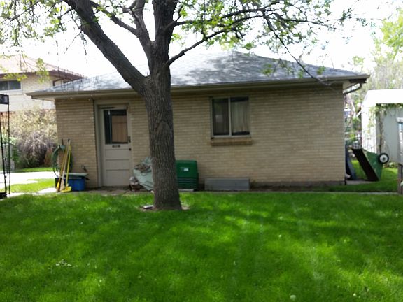 Lushly shaded, fenced backyard