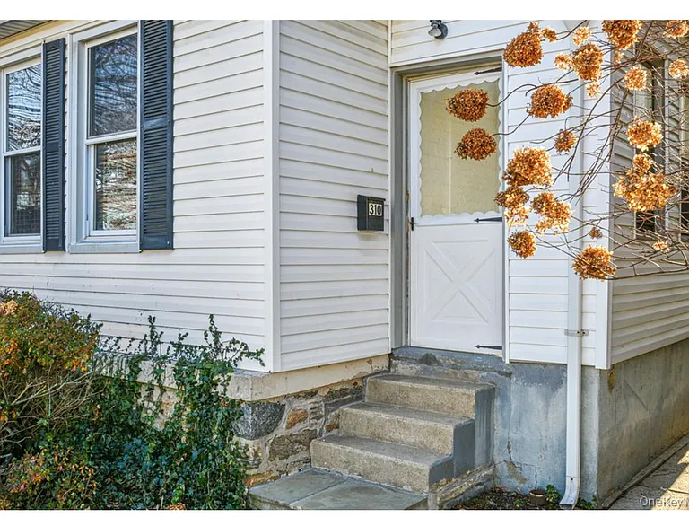 Door leads to enclosed porch