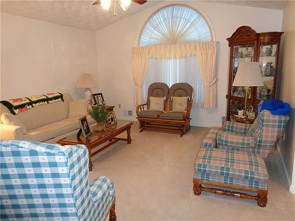 LIVING ROOM WITH CATHEDRAL CEILINGS/PALADIUM WINDOW