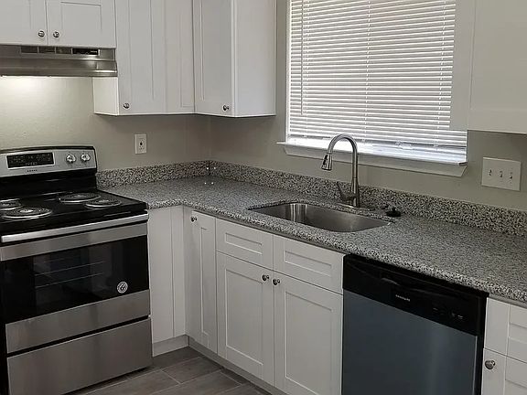 Updated single-bowl sink with detachable spout with multiple settings, garbage disposal. See those corner cabinets? There's a lazy susan behind there!