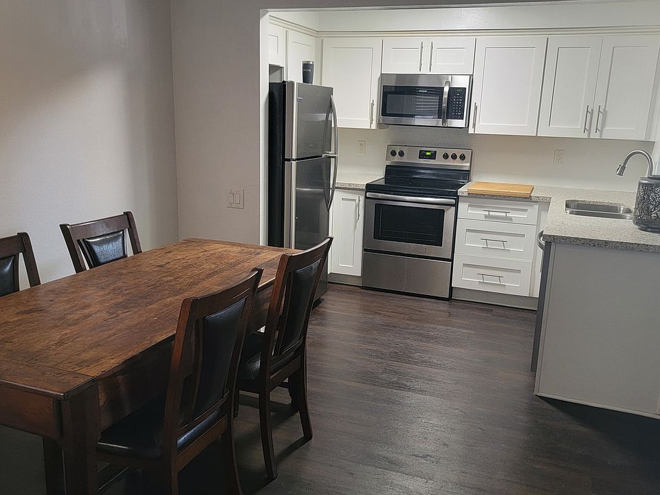 Open-concept kitchen, dining, and living area