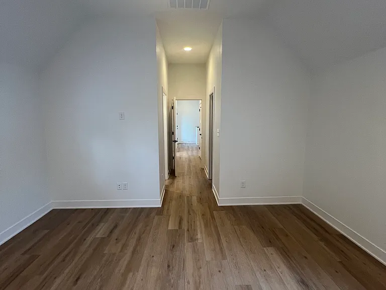 Bedroom with cathedral ceilings