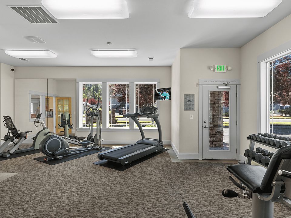 Fully equipped fitness center with cardio, strength machines, and free weights.