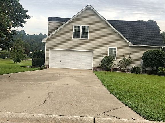 Driveway view of the house