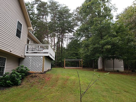 Back yard, deck, raised bed garden and 
shed