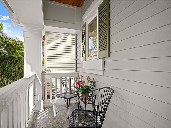 Sidewalk up to covered front and back porch accented by wood soffit.