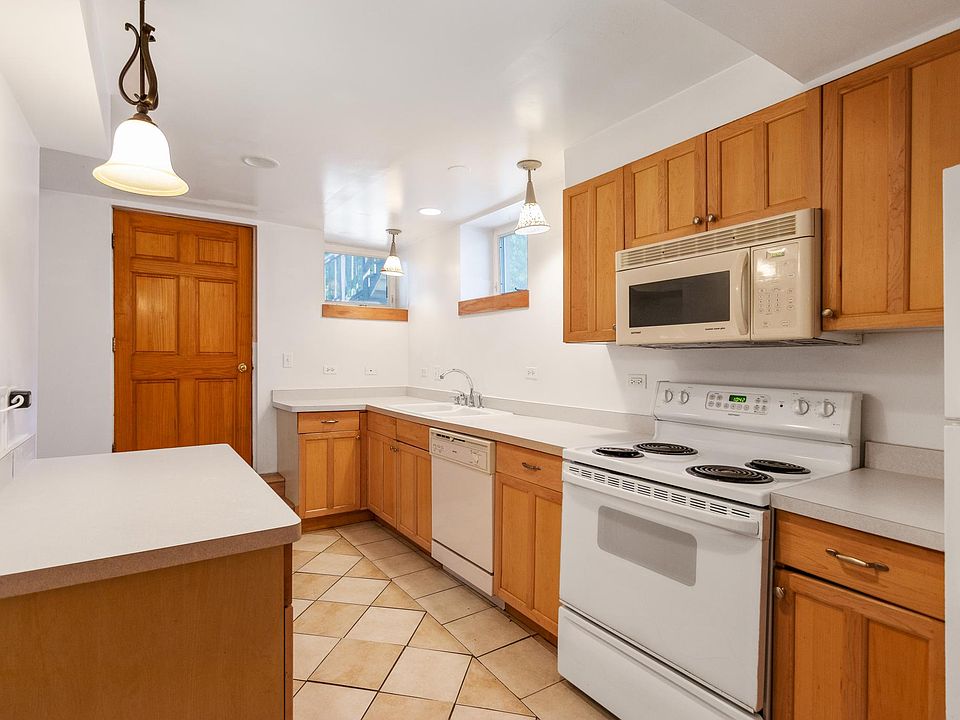 Fantastic Custom Architect inspired Kitchen! All high end built-ins, self-cleaning range. Dishwasher, disposal, built-in microwave oven. large capacity refrigerator/freezer. Built-in Buffet and Cabinet to the left. Great for serving food, drinks or sna