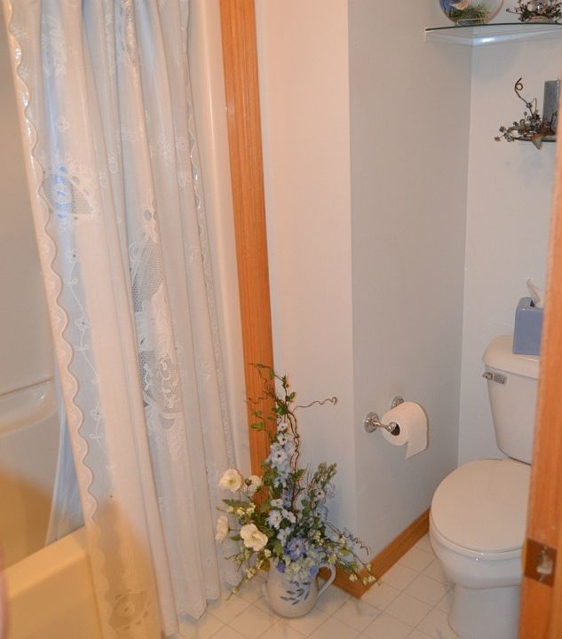 The full bath is centrally located to the bedrooms.  It has a tub/shower combo, nice vanity and is completed in neutral colors.  A linen closet is located just outside the door in the hallway to store your extra linens.