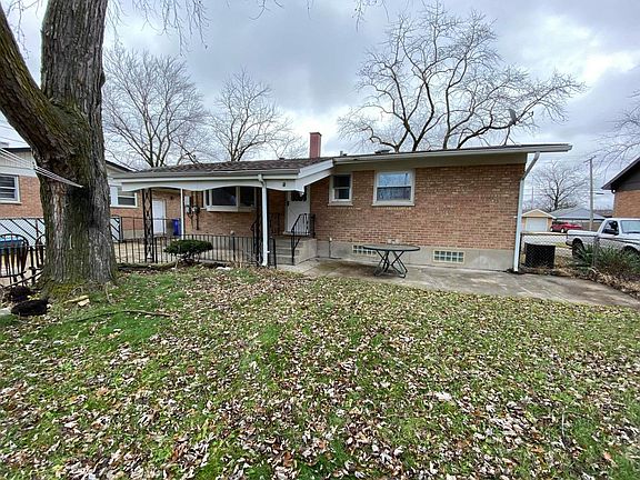 Large backyard with a covered patio.
