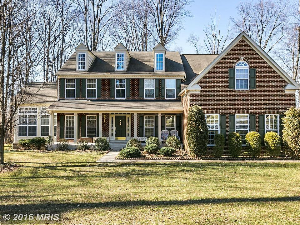 Brick front home w/ porch