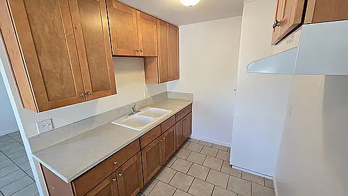 Kitchen with maple cabinetry and Korian counter tops.