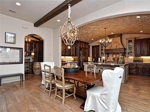 Opens to breakfast bar,wine room and chef's kitchen. Also has a large pantry!