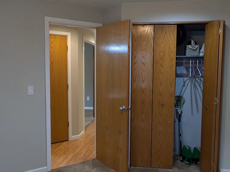 Back bedroom 10' by 11' with closet shelving