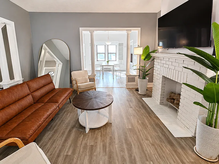 Comfortable living room with decorative fireplace feature
