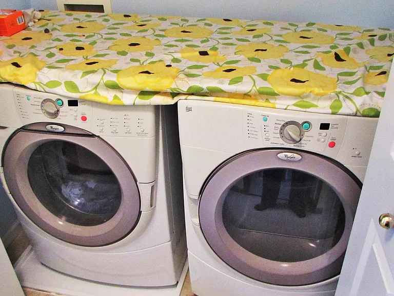 upper laundry with washer & dryer behind doors. No photos of new machines which are already in place