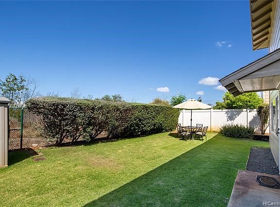 As you walk in through the front gate- this is your private yard!!  Imagine how much fun this yard will be when you entertain or