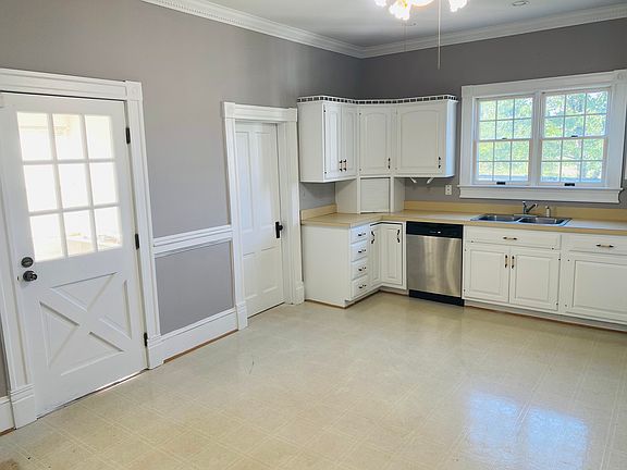 Clean updated kitchen including extras like garbage disposal, dishwasher and view of beautiful acres outside kitchen sink windows