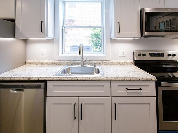 Kitchen with all new full-sized appliances, ground level light