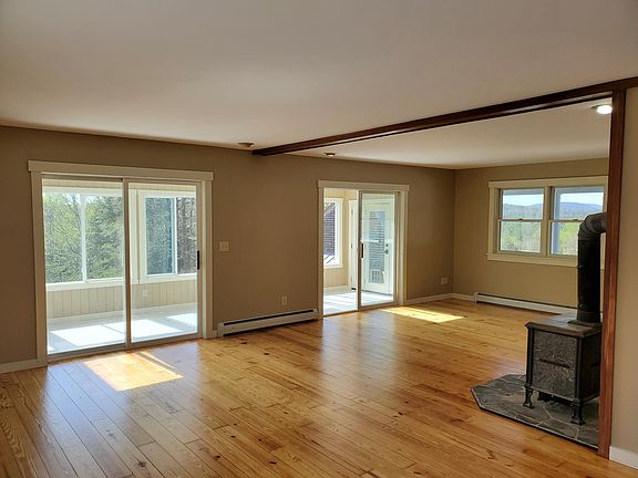 Living room opens to sun porch