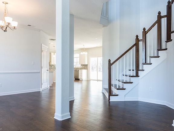 Foyer looking towards dining room and gourmet kitchen. How's this for a spectacular staircase?