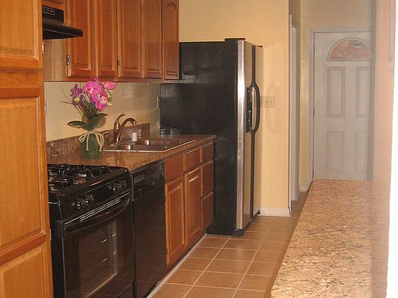 kitchen facing door to deck