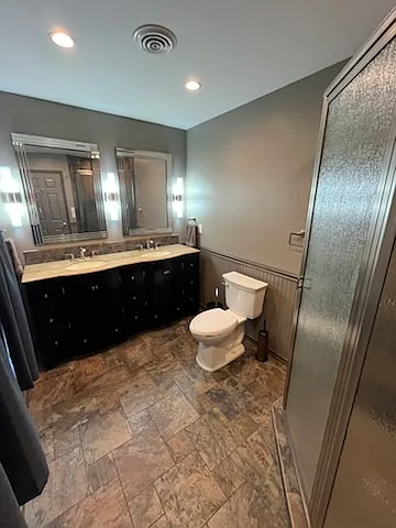 Master Bath! Absolutely Stunning - Double vanity sink over beautiful cabinetry. The vertical lights are on a separate switch and used for makeup application.